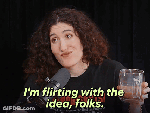 Woman In Black Shirt Says I'm Flirting With The Idea Folks GIF