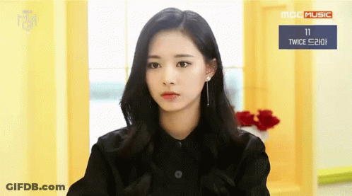 Woman In Black Shirt Sitting By MBC Music Sign GIF