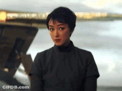 Woman In Black Shirt Standing In Front Of Boat GIF