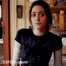 Woman In Black Shirt Standing In Kitchen GIF