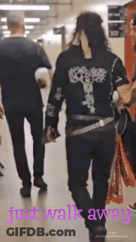 Woman In Black Shirt Walks Away GIF