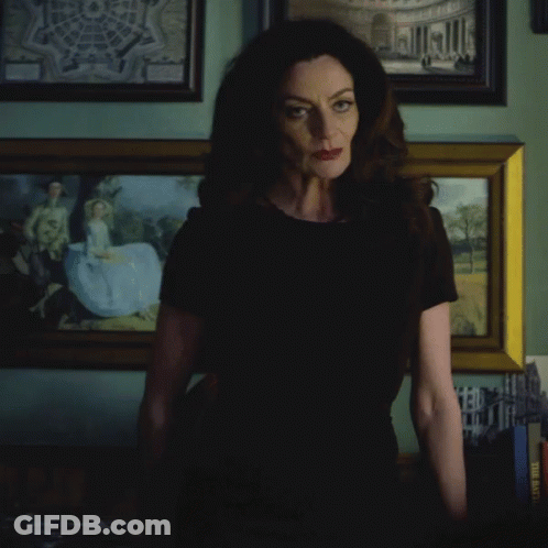 Woman In Black Shirt With Painting When Will The World Learn GIF