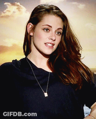 Woman In Black Shirt With Square Pendant Necklace GIF