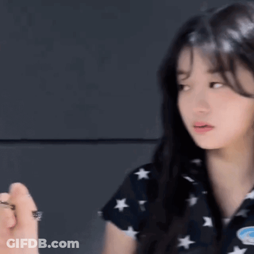 Woman In Black Shirt With Stars GIF