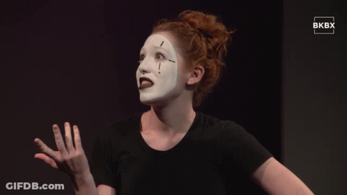 Woman In Black Shirt With White Face Paint GIF