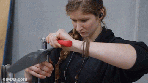 Woman In Black Shirt Working Metal GIF