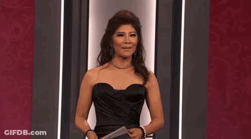 Woman In Black Strapless Dress Holding Microphone GIF