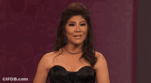 Woman In Black Strapless Dress With Necklace GIF