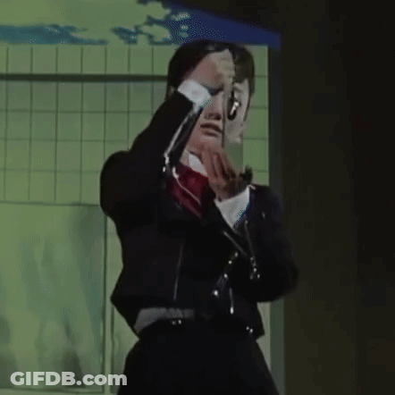 Woman In Black Suit And Red Bow Tie GIF