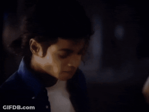 Woman In Black Suit And Red Gloves In Bazaar Magazine GIF