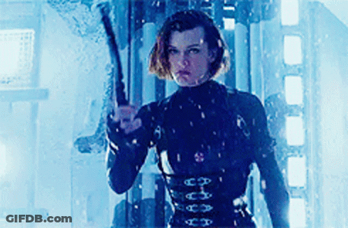 Woman In Black Suit Holding Gun GIF