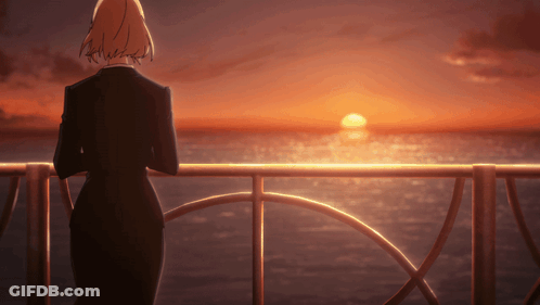 Woman In Black Suit Overlooking Ocean Sunset GIF