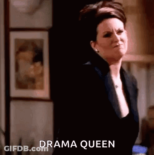Woman In Black Suit Saying Drama Queen GIF