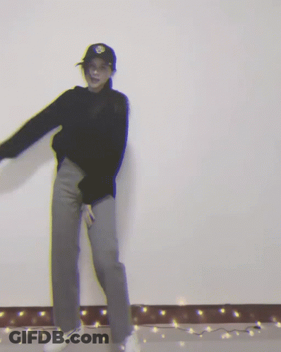 Woman In Black Sweater And Hat Dancing GIF