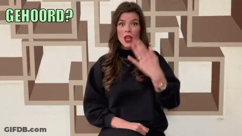 Woman In Black Sweater Gesturing With Gehoord GIF