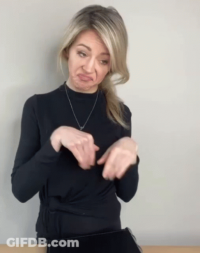 Woman In Black Sweater Making Face With Hands GIF