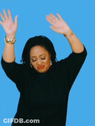 Woman In Black Sweater Raising Hands GIF