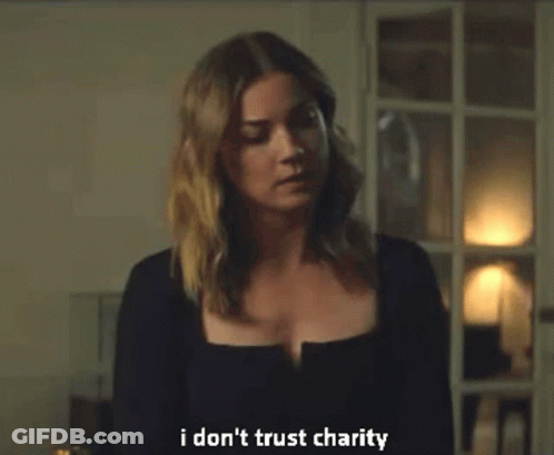 Woman In Black Sweater Saying I Don't Trust Charity GIF