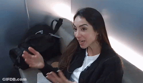 Woman In Black Sweater Sitting On Chair GIF