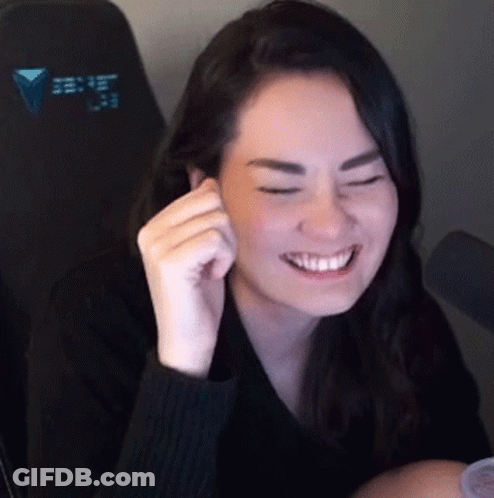 Woman In Black Sweater Smiling With Eyes Closed GIF