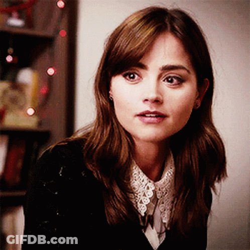 Woman In Black Sweater With White Lace Collar GIF