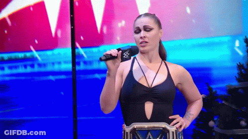 Woman In Black Swimsuit Holding Microphone GIF