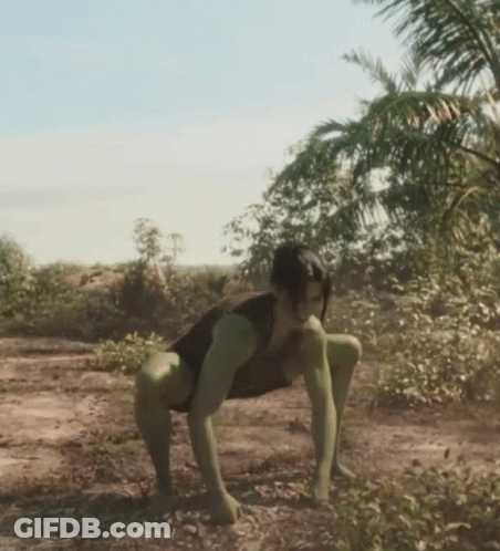 Woman In Black Tank Top And Green Tights Crawling In Dirt GIF