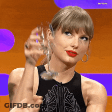 Woman In Black Tank Top Holding Glass GIF