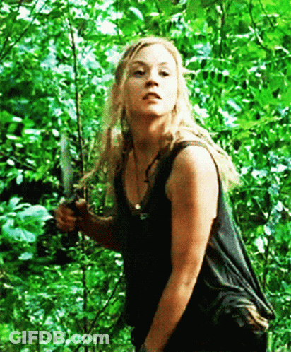 Woman In Black Tank Top Holding Knife GIF