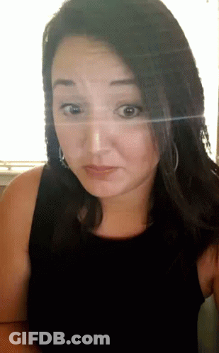 Woman In Black Tank Top Looks Surprised GIF