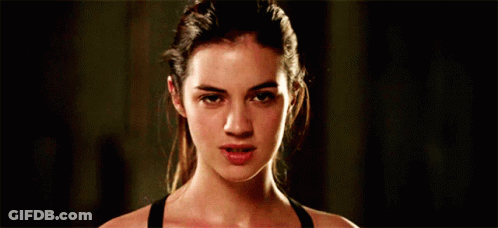 Woman In Black Tank Top Making Funny Face GIF