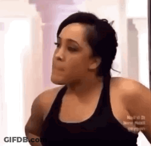 Woman In Black Tank Top Making Funny Face GIF