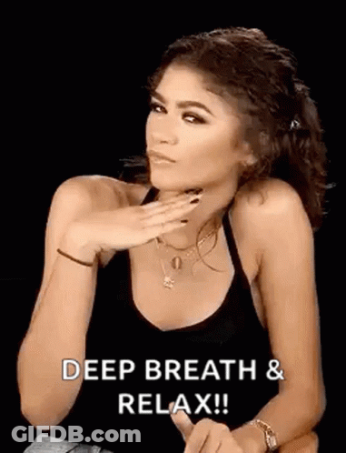 Woman In Black Tank Top Saying Deep Breath Relax GIF