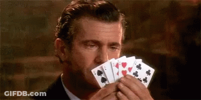Woman In Black Tank Top Sitting With Hand On Chin GIF