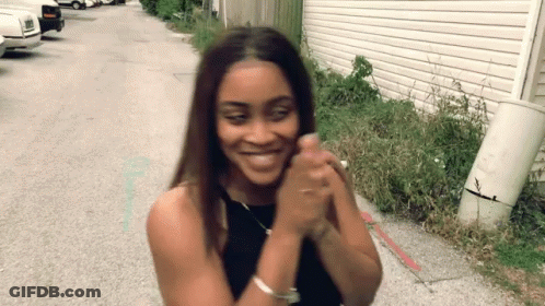 Woman In Black Tank Top Smiling GIF