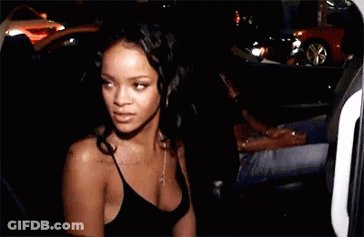 Woman In Black Tank Top Standing By Car At Night GIF