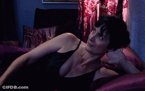 Woman In Black Tank Top Stretching GIF