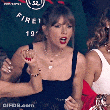 Woman In Black Tank Top With Green Shirt Saying Fire 19 GIF