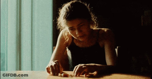 Woman In Black Tank Top With Hands On Table GIF