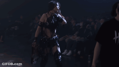 Woman In Black Top And Gloves Dancing GIF