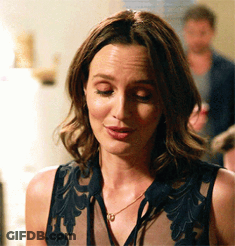 Woman In Black Top And Gold Necklace GIF