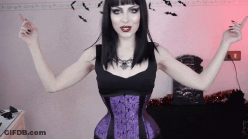 Woman In Black Top And Purple Corset GIF