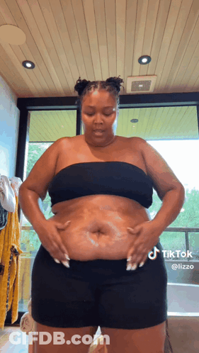 Woman In Black Top And Shorts In Bathroom GIF