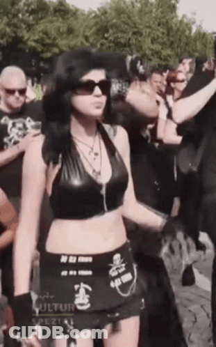 Woman In Black Top And Skirt With Kultur GIF