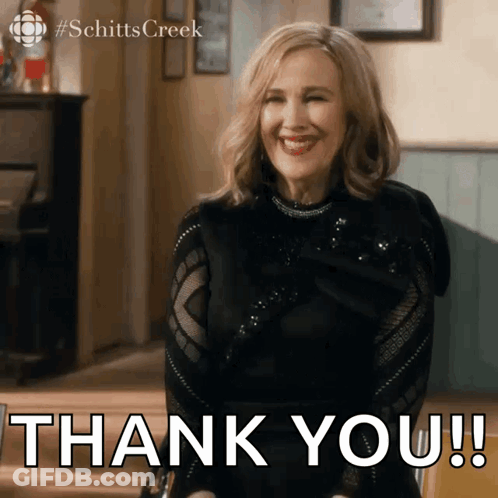 Woman In Black Top Smiling Thank You GIF