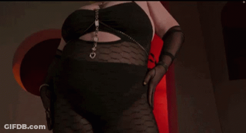 Woman In Black Top With Chain Smiling GIF