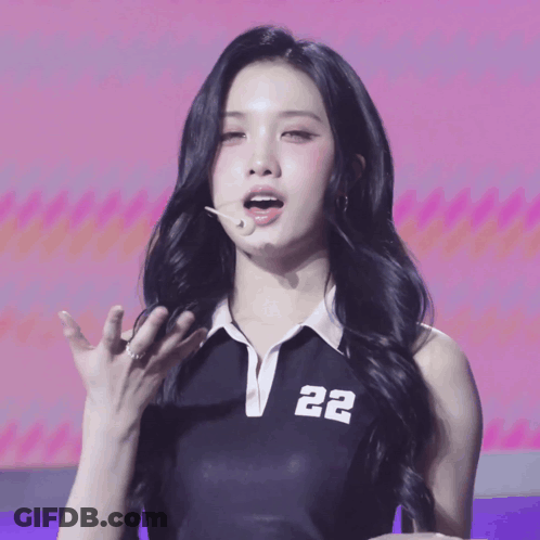 Woman In Black Top With Number 22 GIF