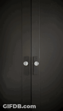 Woman In Black Turtleneck And Gold Hoop Earrings GIF