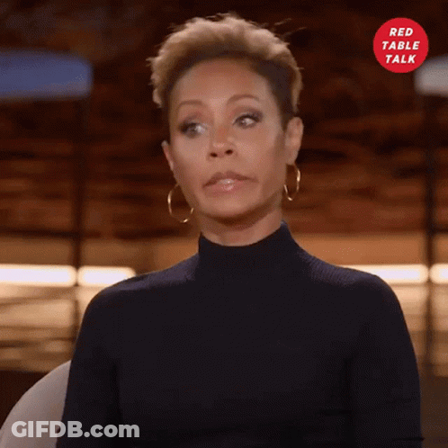 Woman In Black Turtleneck And Gold Hoop Earrings GIF