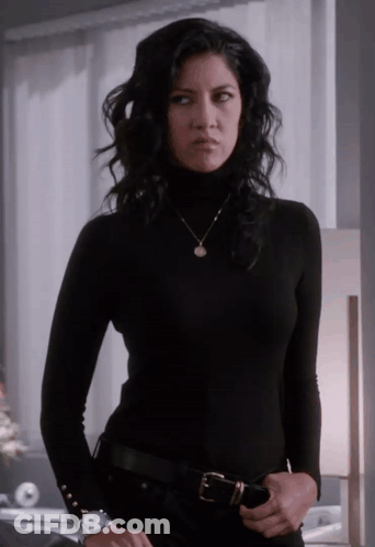 Woman In Black Turtleneck And Necklace GIF
